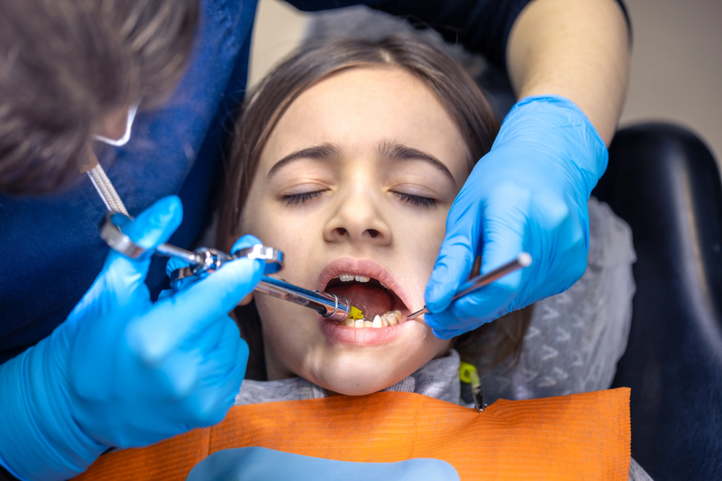 girl-dentists-office-dentist-examining-child-patients-teeth-dentistry-concept (1)