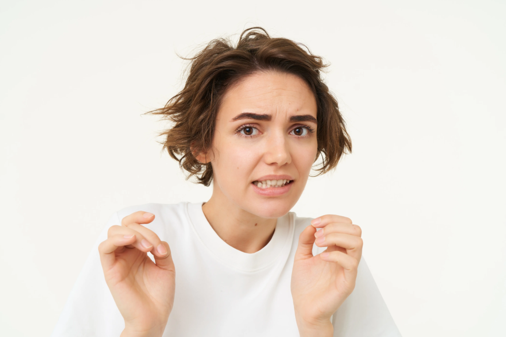 portrait-woman-jumps-from-fear-looks-disgusted-cringe-from-something-express-dislike-aversion